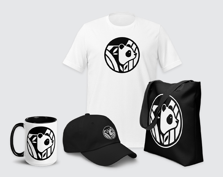A product shot of a panda-branded t-shirt, mug, tote bag and baseball cap.