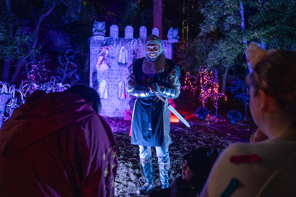 A costumed knight performer entertains guests at Boo at the Zoo.