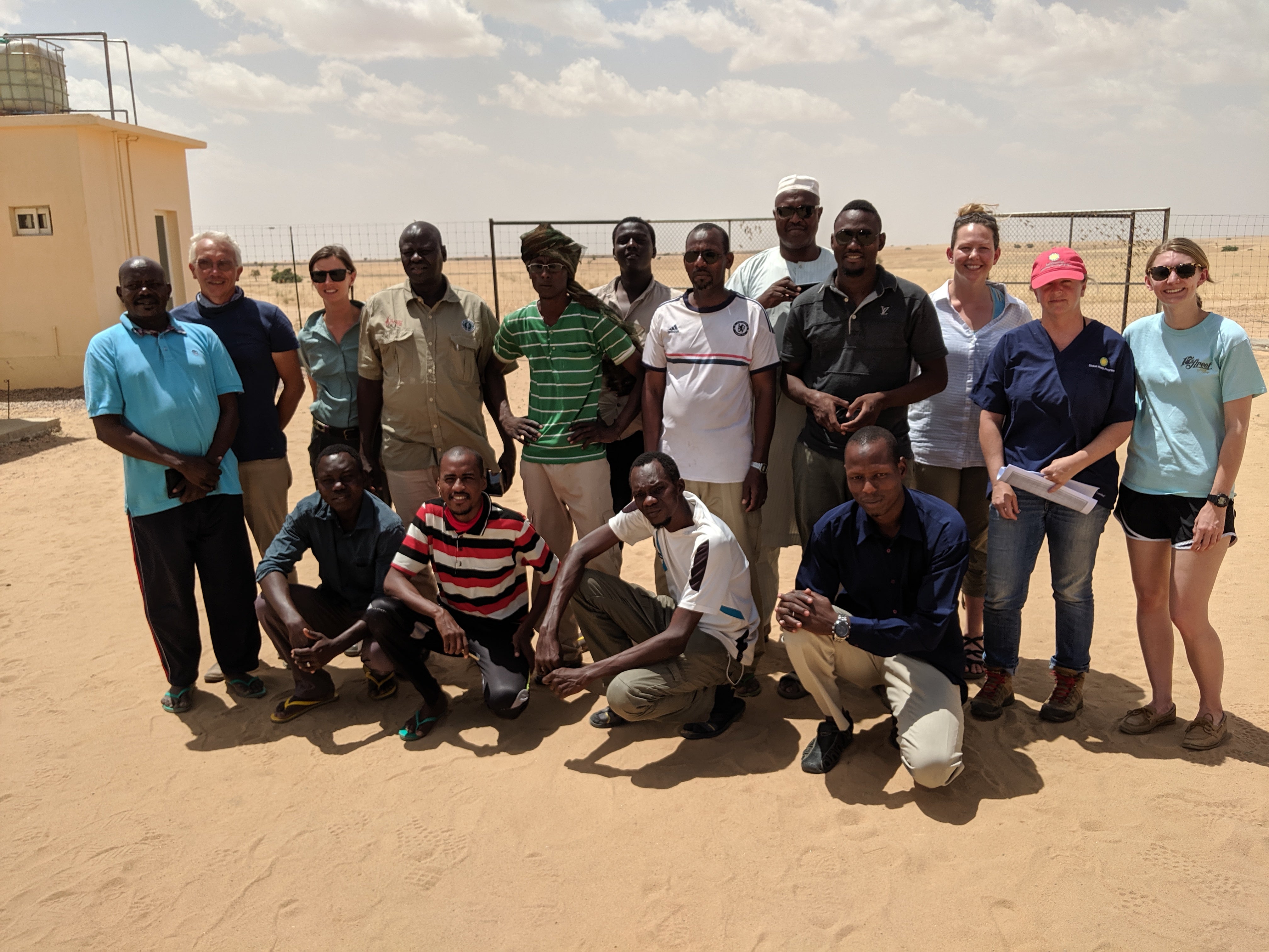 A group of students and teachers from a pathology workshop held in Chad pose together for a photo