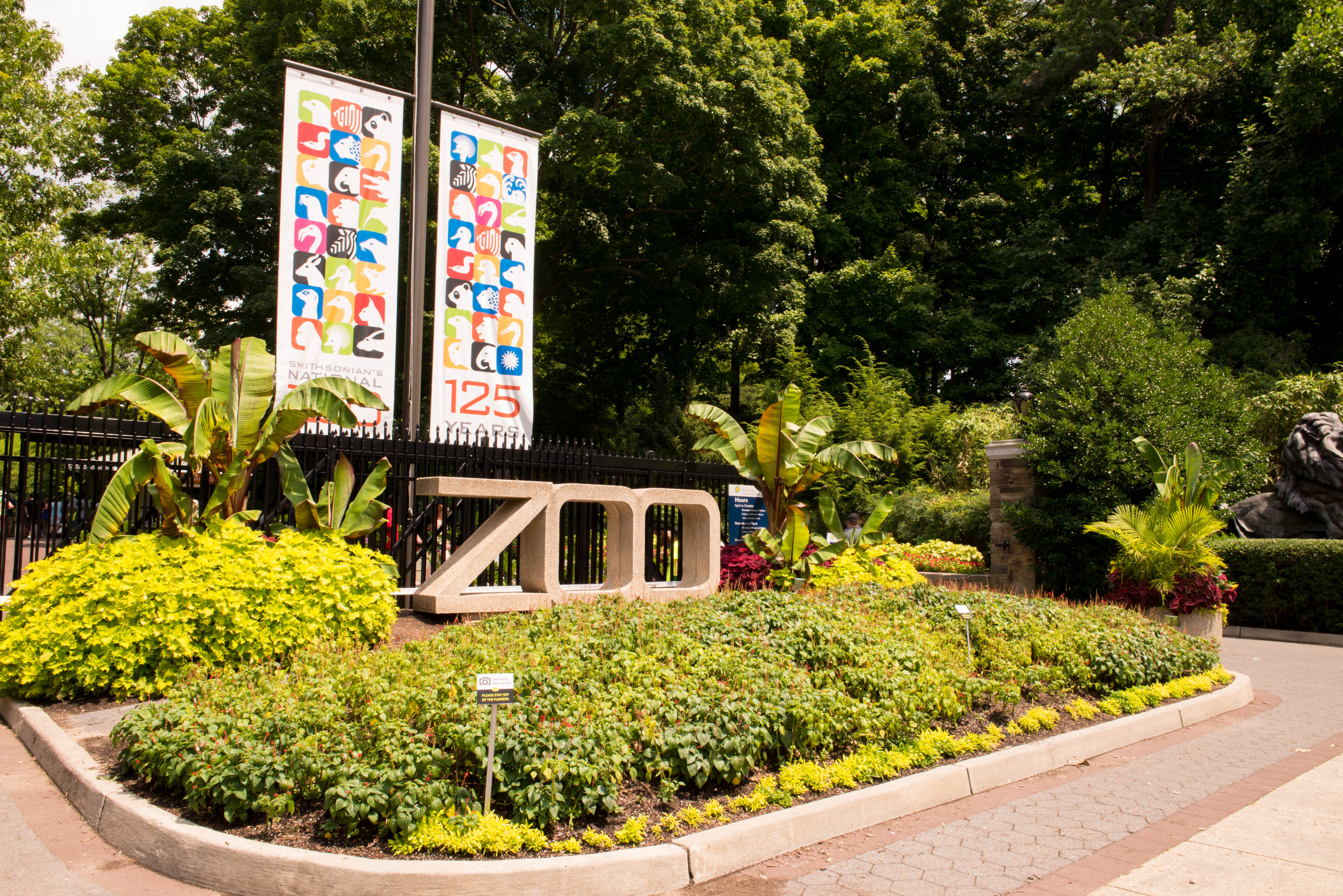 Zoo entrance with icon banners. 