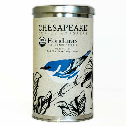 a coffee tin with an image of a Cerulean Warbler perched on a branch with leaves