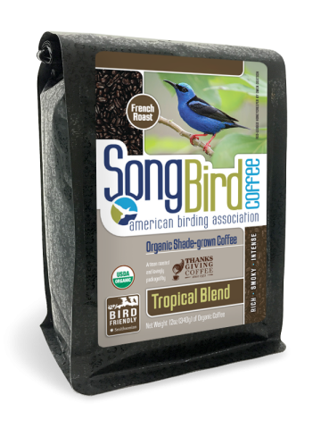 a coffee bag with an image of a Red-legged Honeycreeper and roasted coffee beans