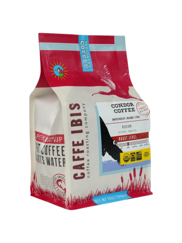 a coffee bag with an image of an Ibis flying above a wetland