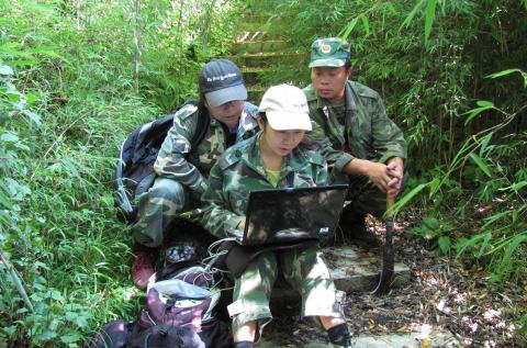 Scientists and students training in a forest in China