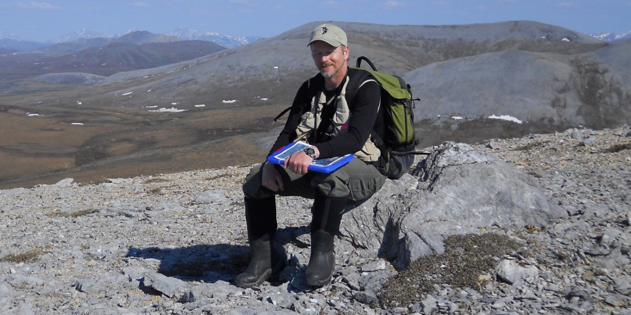 A photo of Rick Lanctot conducting fieldwork.