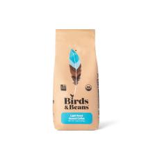 a coffee bag with a graphic illustration of a bird feather