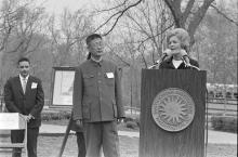First Lady Patricia Nixon speaks at a podium at the Zoo April 20, 1972, for the official welcome ceremony for giant pandas Ling Ling and Hsing Hsing