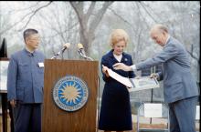 First Lady Patricia Nixon receives a gift of a photo of giant pandas at the Zoo April 20, 1972, for the official welcome ceremony for giant pandas Ling Ling and Hsing Hsing