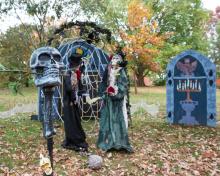 A spooky Halloween display with skeletons. 