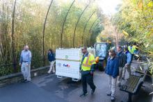 Smithsonian staff and keepers escort giant panda Bei Bei's crate as he is brought out of his enclosure at the Smithsonian's National Zoo.