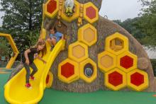 Children on slide at the Me and The Bee Playground