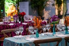 A table with linens, glasses and flowers at the Smithsonian's National Zoo's Monkey Business Gala