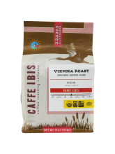 a coffee bag with an image of an Ibis flying above a wetland