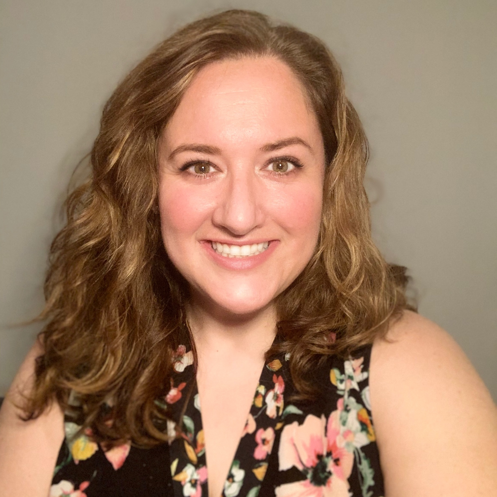 Female scientist with long brown hair.