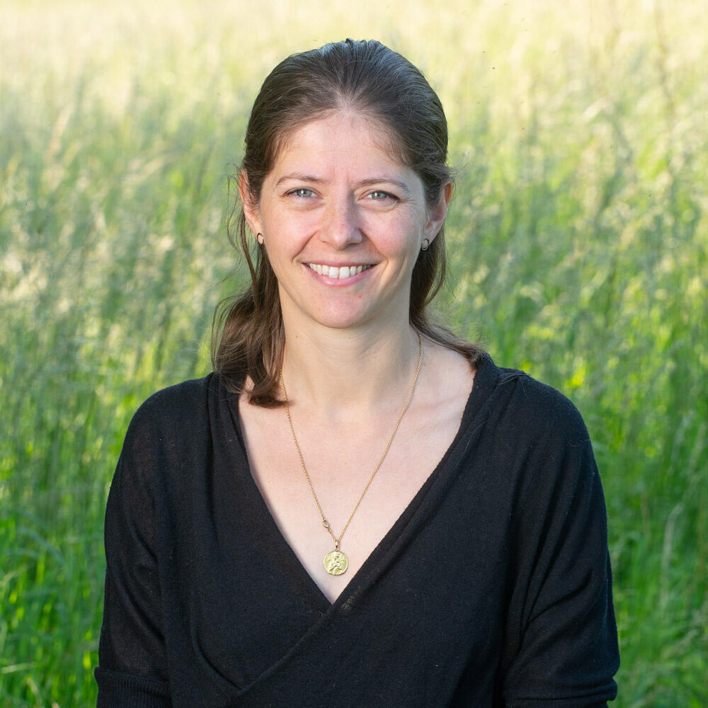 Female researcher wearing a black shirt.