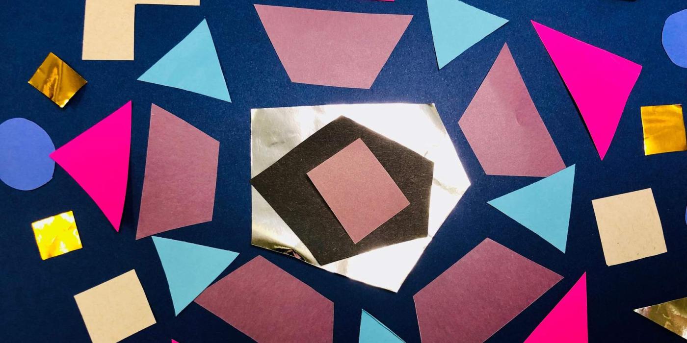 A collage of different shapes of different colors of paper