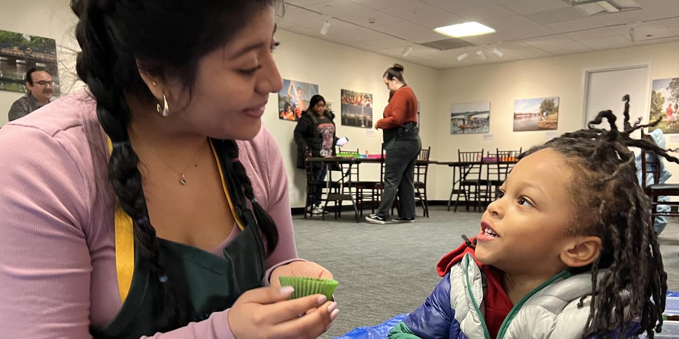 Early childhood facilitator has conversation with young child