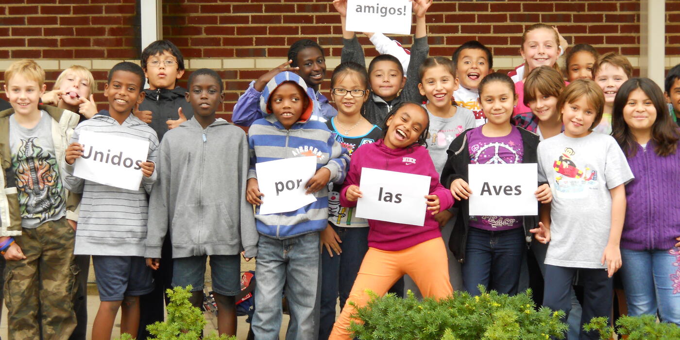 A class of smiling elementary school children