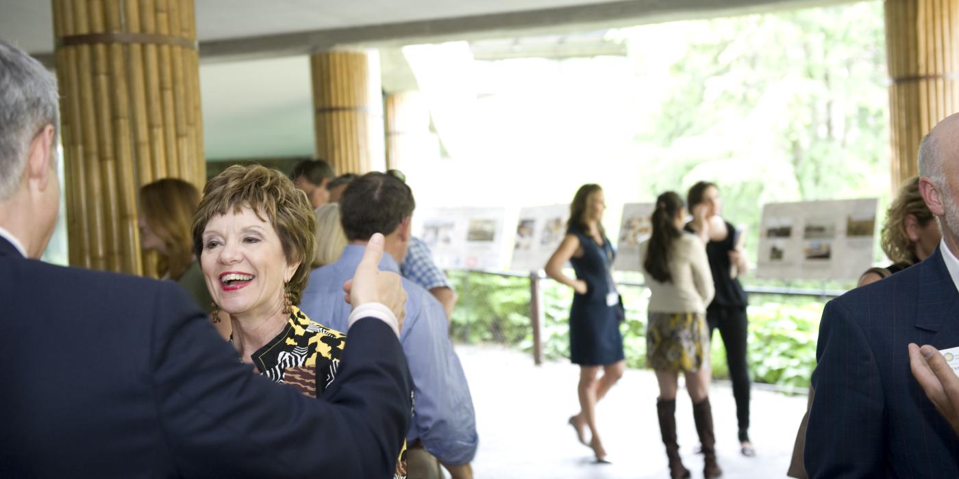 Guests mingle during a private catered event overlooking the panda yards at the Smithsonian's National Zoo