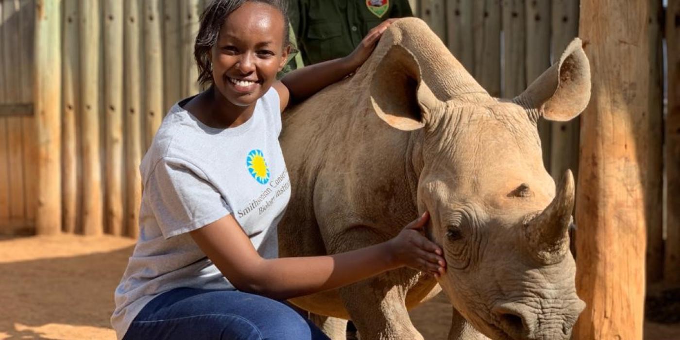 Global Health Program wildlife veterinarian Maureen Wanjiku Kamau with a young rhinocerous