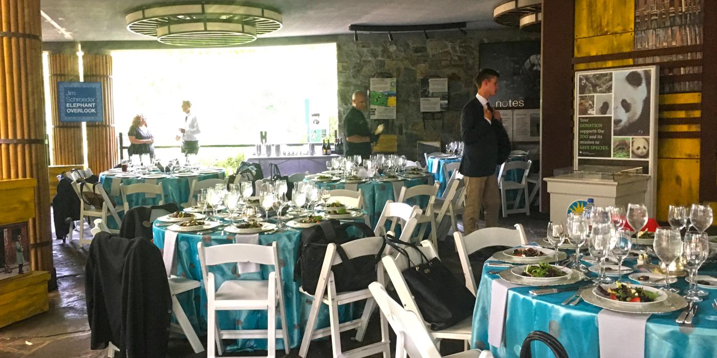Tables decorated for a catered event at the Smithsonian's National Zoo's Clint Fields Plaza